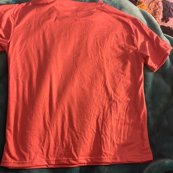 This is a large short sleeve t-shirt from SHEIN and is a light pink color. - Picture 4 of 4